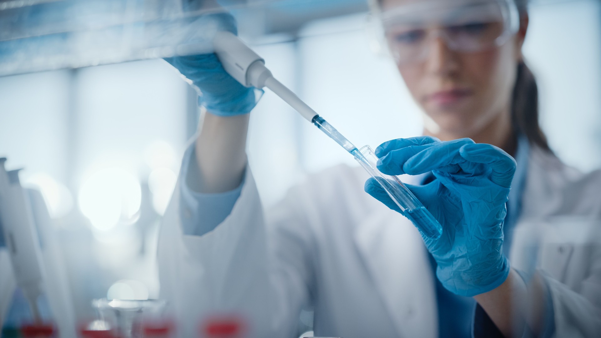 Medical Research Laboratory: Portrait of a Beautiful Female Scientist Using Micro Pipette for Analysis. Advanced Scientific Lab for Medicine, Biotechnology, Microbiology Development. Hands Close-up
